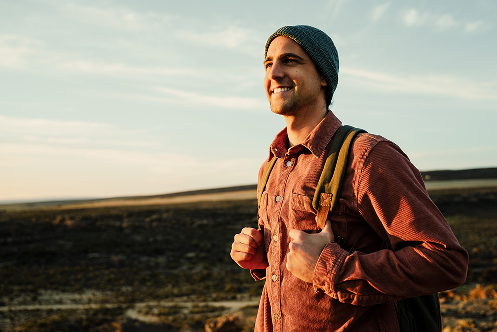 Smiling man on outdoor walk